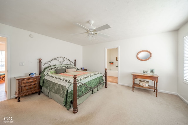 bedroom with carpet flooring, multiple windows, and ceiling fan