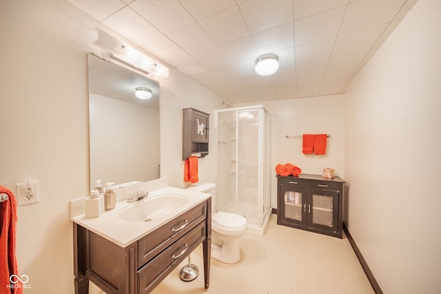 bathroom with vanity, an enclosed shower, and toilet