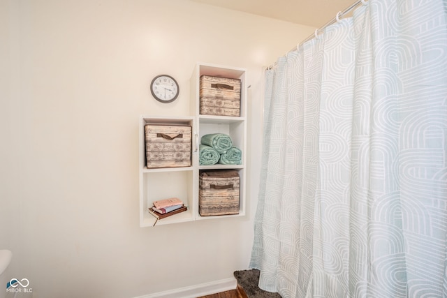 bathroom with hardwood / wood-style flooring