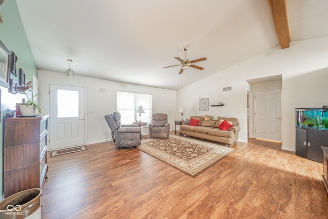 living room featuring ceiling fan, lofted ceiling with beams, and hardwood / wood-style flooring