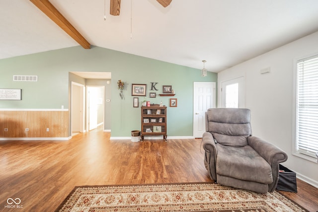 sitting room featuring vaulted ceiling with beams, ceiling fan, and hardwood / wood-style flooring