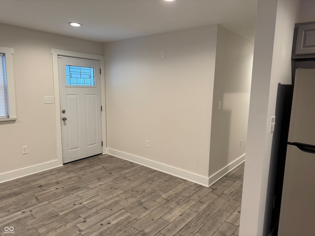 foyer entrance with light hardwood / wood-style flooring