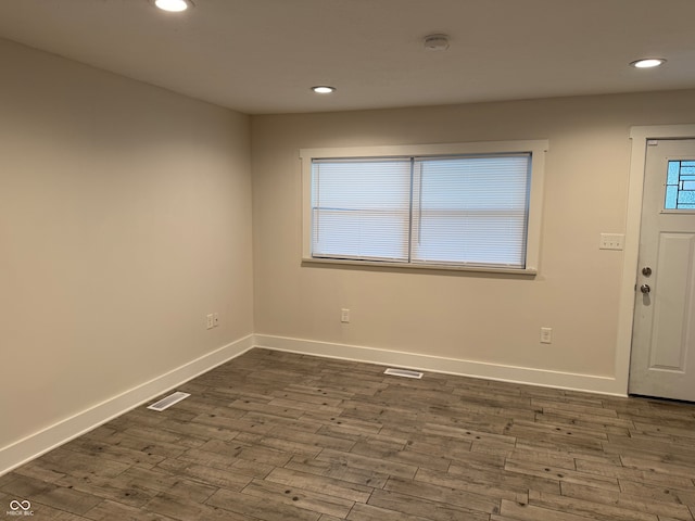 foyer entrance featuring dark wood-type flooring