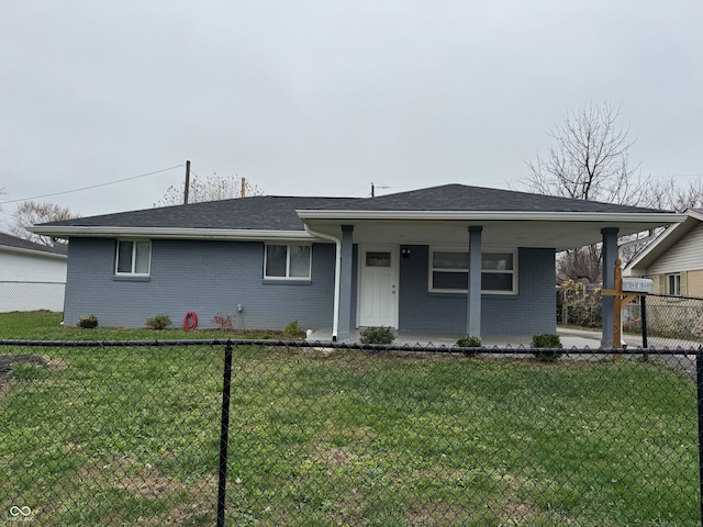 single story home featuring covered porch and a front yard