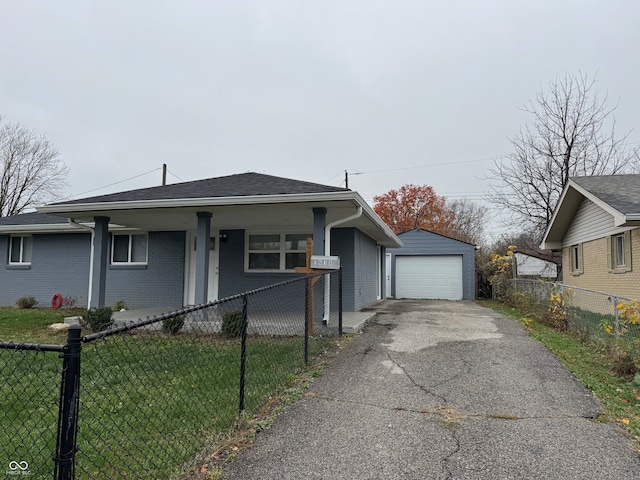 view of front of house with a porch, a garage, an outdoor structure, and a front lawn