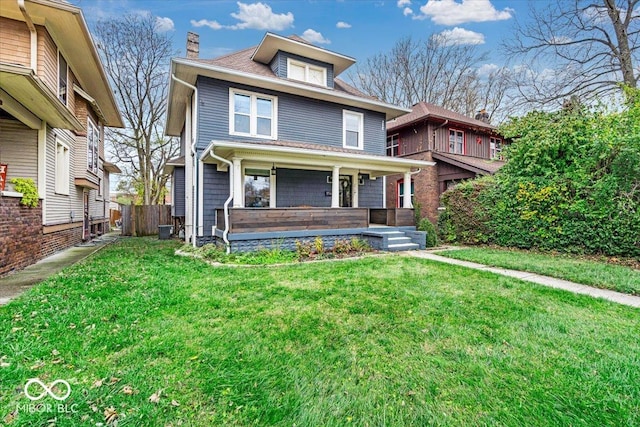 view of front of property with central AC unit, a porch, and a front yard