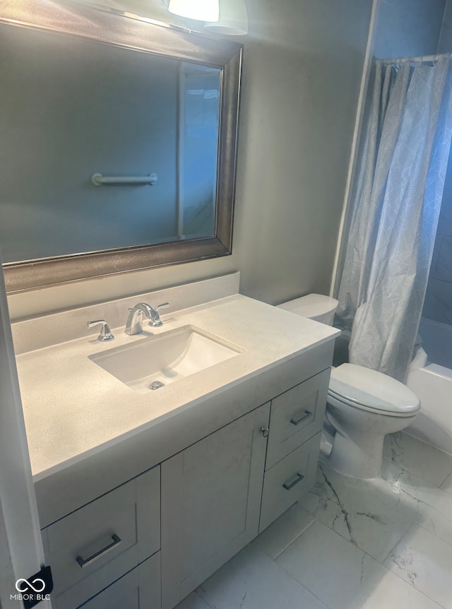 bathroom with vanity, toilet, shower / bath combo, and marble finish floor