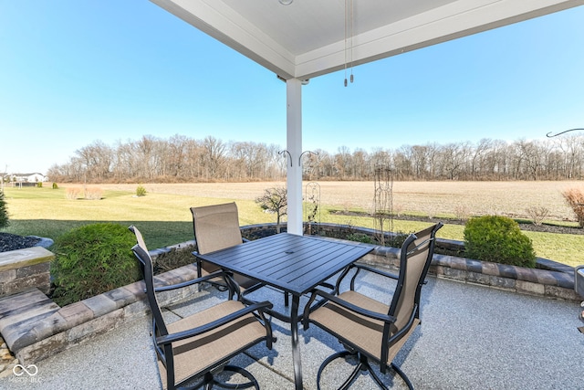 view of patio / terrace featuring a rural view