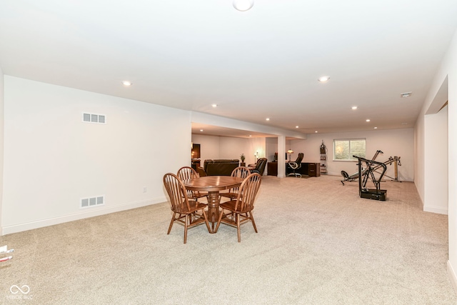 view of carpeted dining space