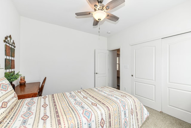 bedroom with a closet, ceiling fan, and carpet