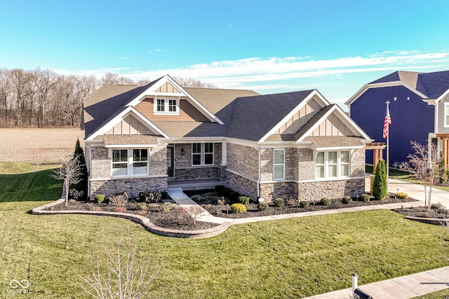 craftsman-style house with a front lawn