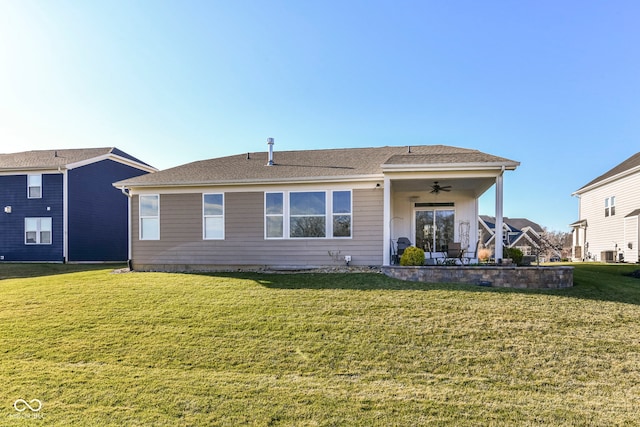 view of front facade with ceiling fan, a front yard, a patio, and central air condition unit