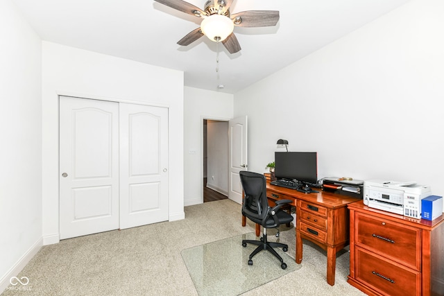 carpeted office with ceiling fan