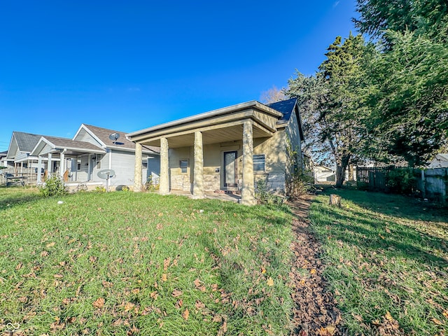 rear view of house with a lawn