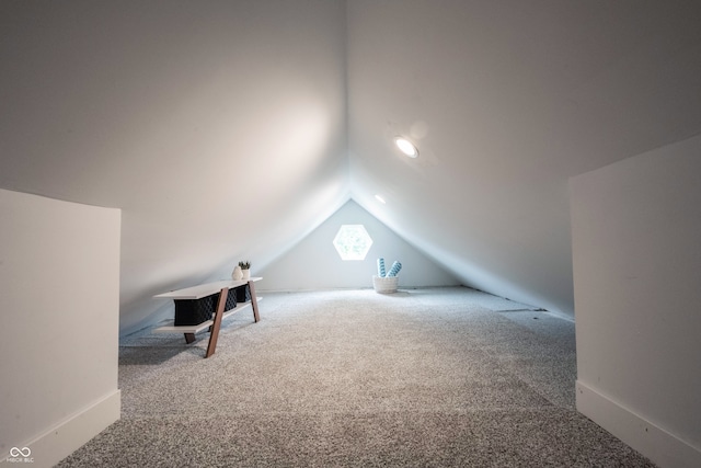 bonus room featuring carpet floors and lofted ceiling