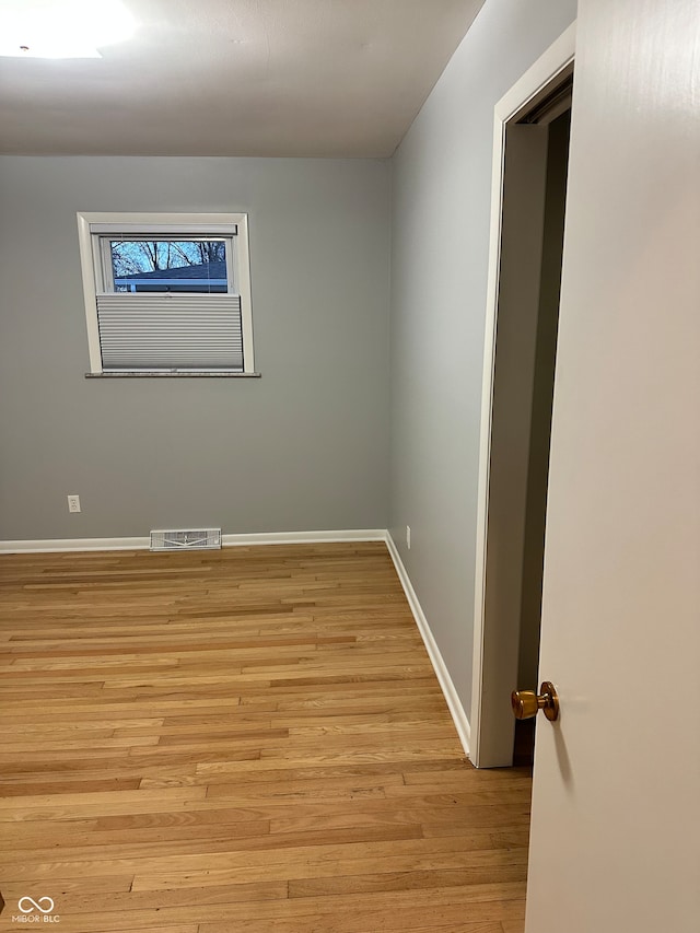 spare room with light wood-type flooring