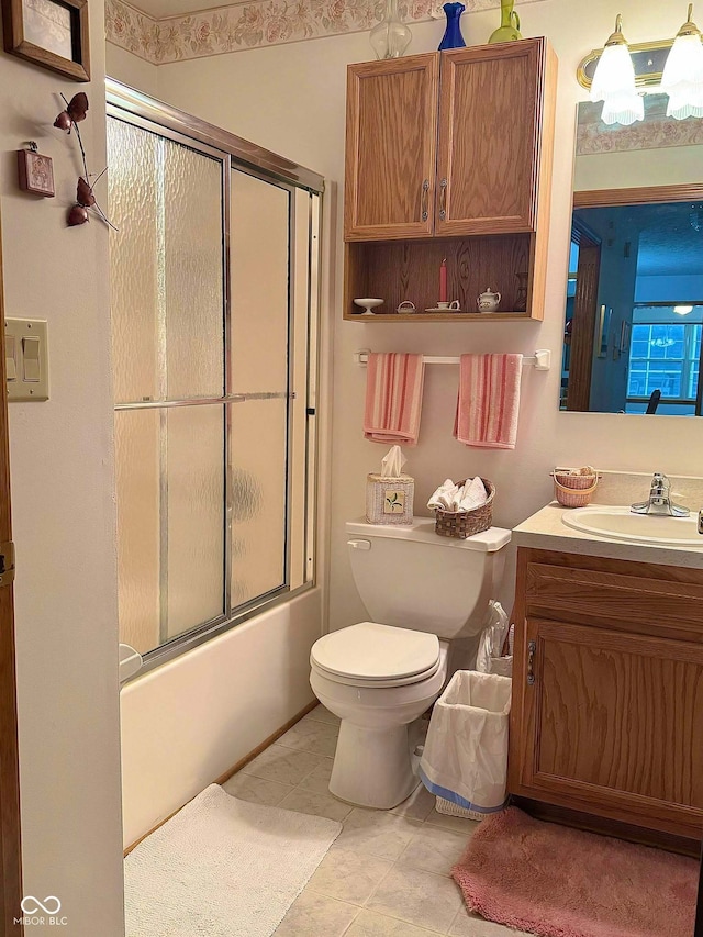 full bathroom with tile patterned flooring, vanity, toilet, and enclosed tub / shower combo