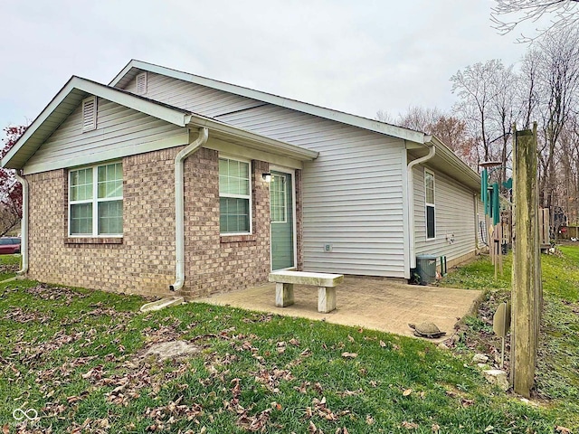 exterior space featuring a patio and a front yard