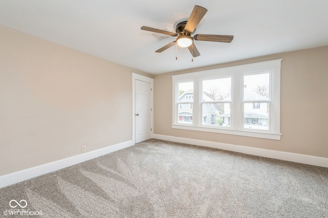 unfurnished room featuring carpet and ceiling fan