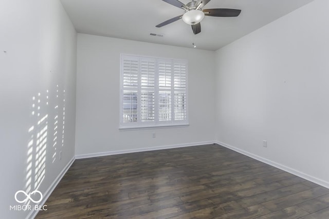 unfurnished room featuring dark hardwood / wood-style flooring and ceiling fan