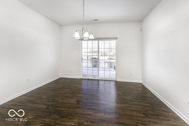 unfurnished dining area with a chandelier and dark wood-type flooring