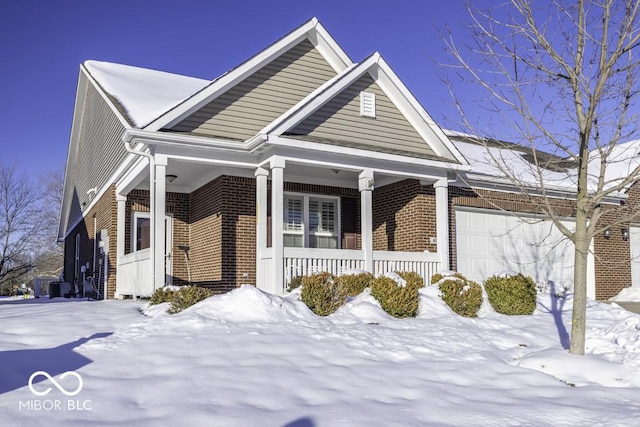 view of front of home with covered porch and a garage