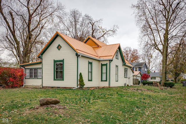 view of property exterior with a lawn