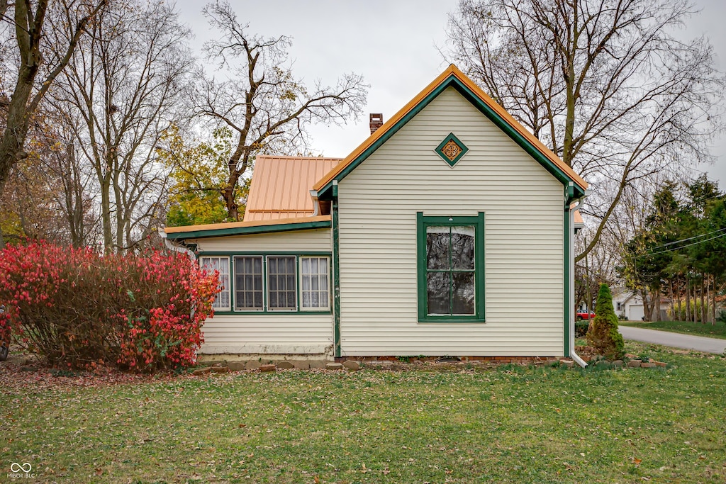 view of home's exterior featuring a lawn