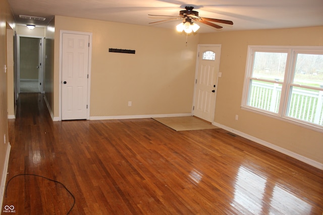 foyer entrance with hardwood / wood-style flooring and ceiling fan