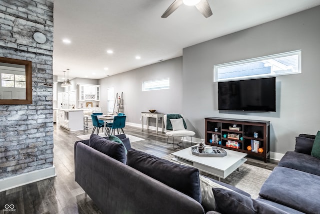 living room with hardwood / wood-style flooring and ceiling fan