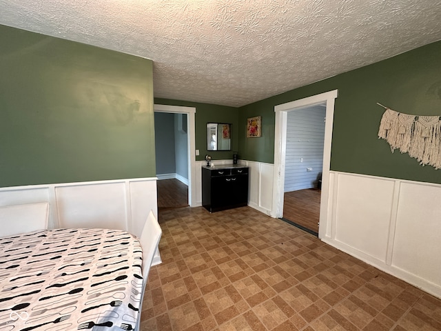 unfurnished bedroom with a textured ceiling