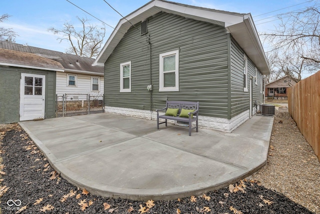 rear view of property with a patio and cooling unit