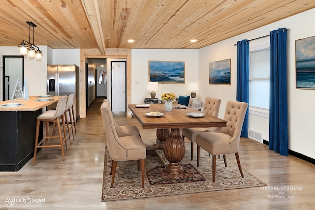 dining space with beamed ceiling, light hardwood / wood-style floors, wooden ceiling, and a chandelier