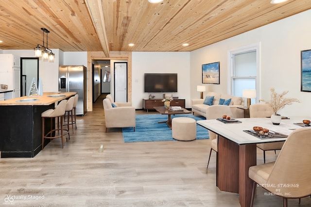 living room with beamed ceiling, light hardwood / wood-style flooring, and wood ceiling