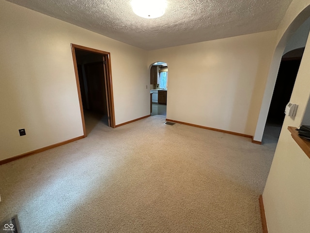 spare room featuring a textured ceiling