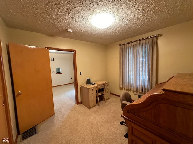 carpeted bedroom with a textured ceiling