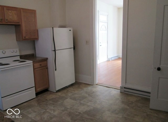 kitchen with plenty of natural light, white appliances, and a baseboard radiator