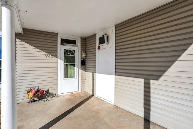 entrance to property with a wall mounted air conditioner