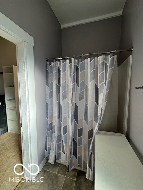 bathroom with a shower with curtain