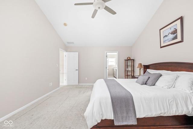 carpeted bedroom featuring ensuite bath, ceiling fan, and lofted ceiling