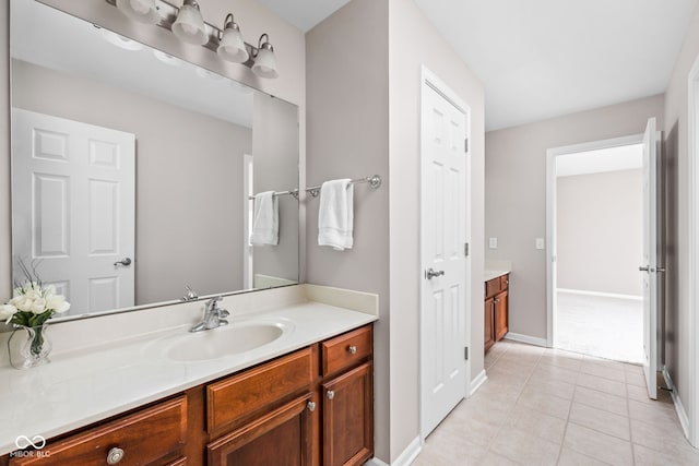 bathroom with tile patterned floors and vanity