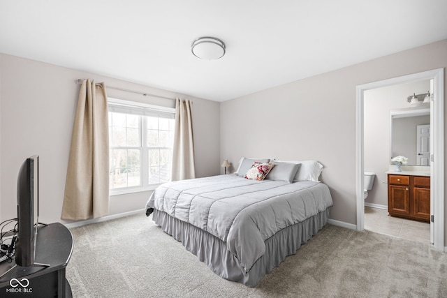 carpeted bedroom with ensuite bathroom