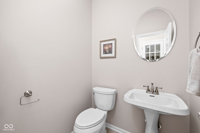 bathroom featuring sink and toilet