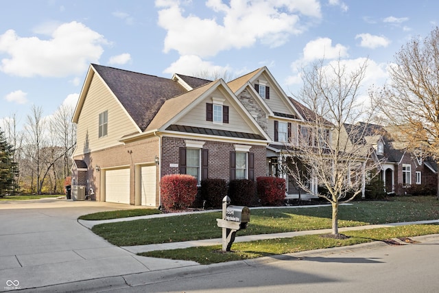 view of front of property featuring central AC unit, a garage, and a front lawn