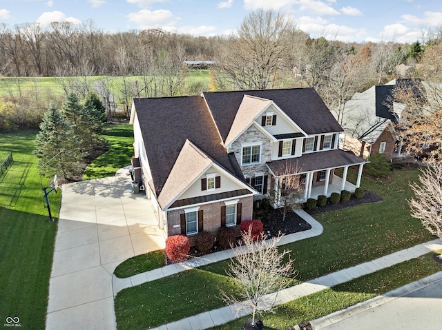 view of front of property with a porch and a front yard