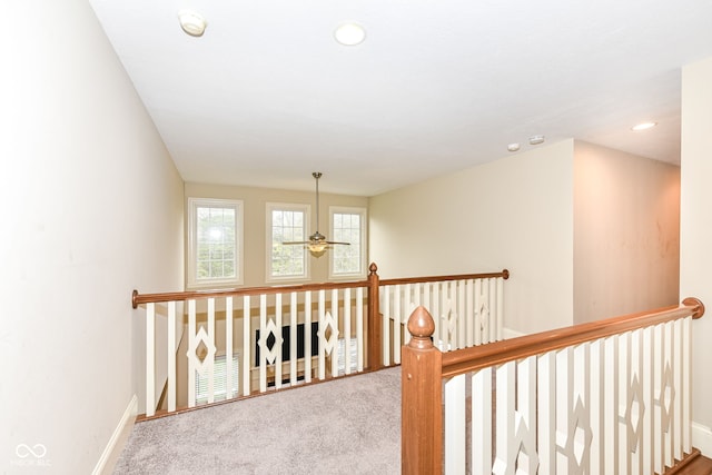 hallway featuring carpet