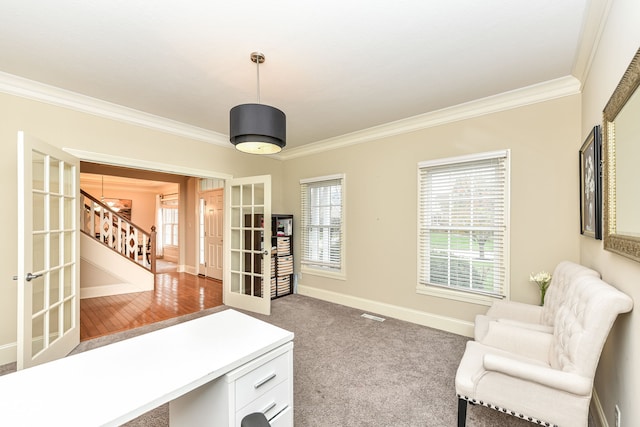 carpeted home office with french doors, a notable chandelier, and ornamental molding