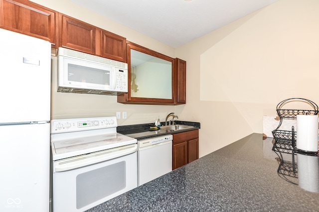 kitchen with white appliances and sink