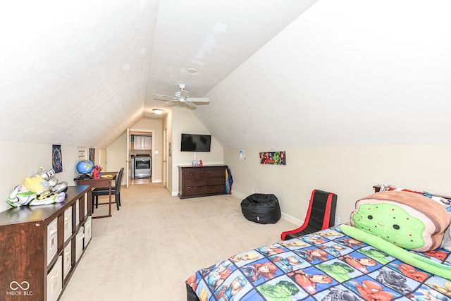 bedroom featuring light carpet, ceiling fan, and vaulted ceiling