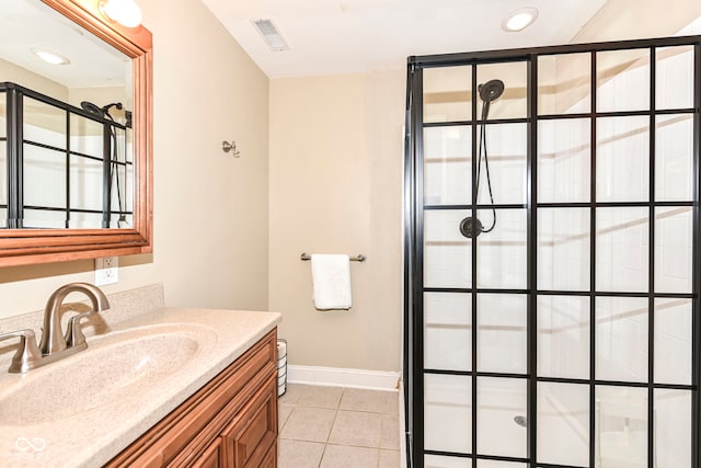 bathroom featuring tile patterned floors and vanity